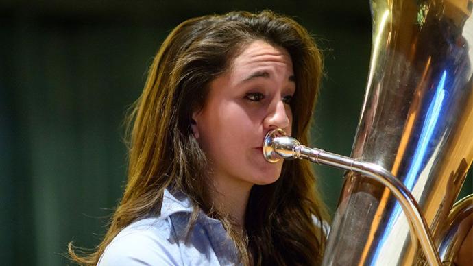 A girl playing the tuba