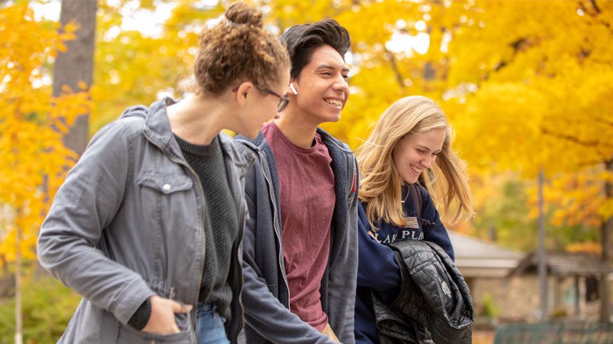 Interlochen Arts Academy students laugh as they walk to class.