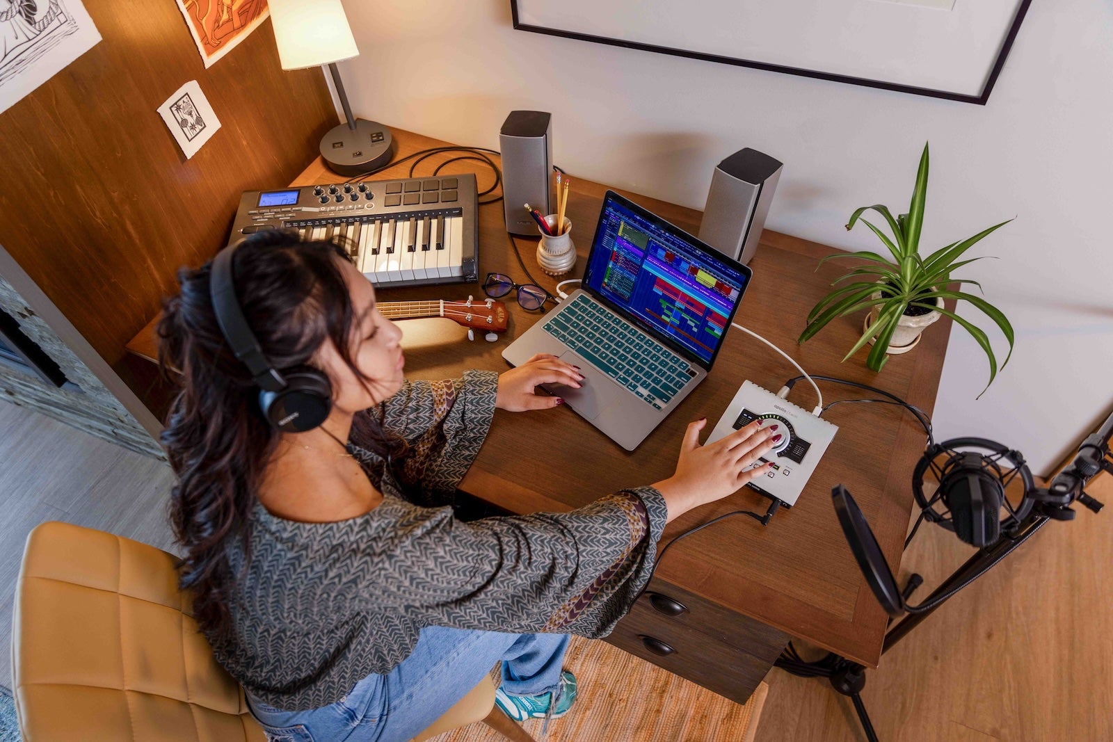 Girl working with a digital audio workstation (DAW) on a laptop