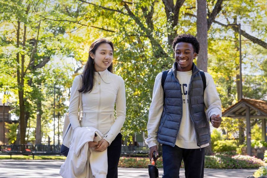 Interlochen Arts Academy students laugh as they walk to class. 