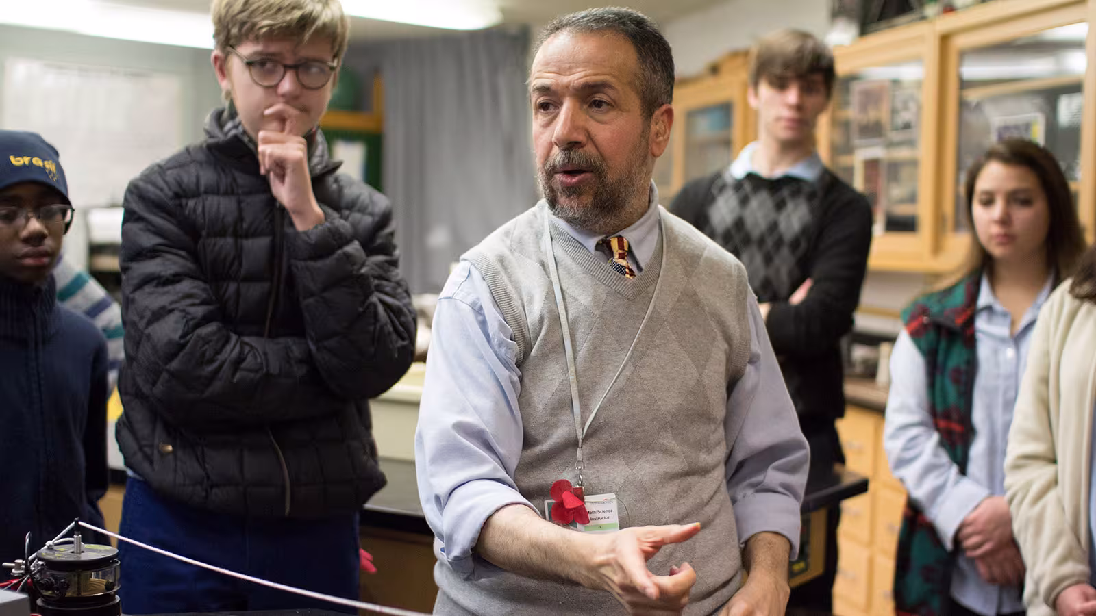 A man teaching a group of students