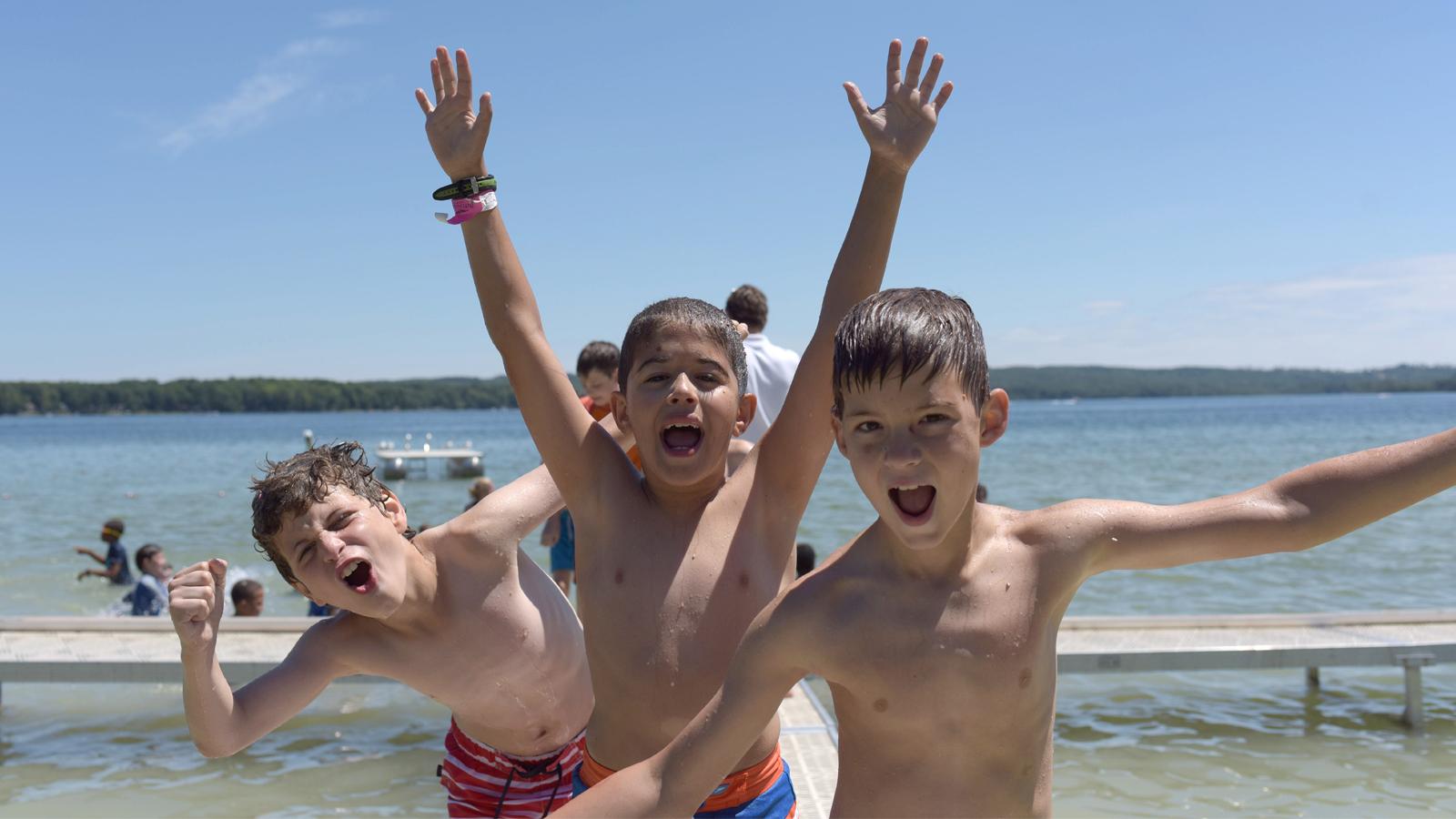 A group of boys near a lake
