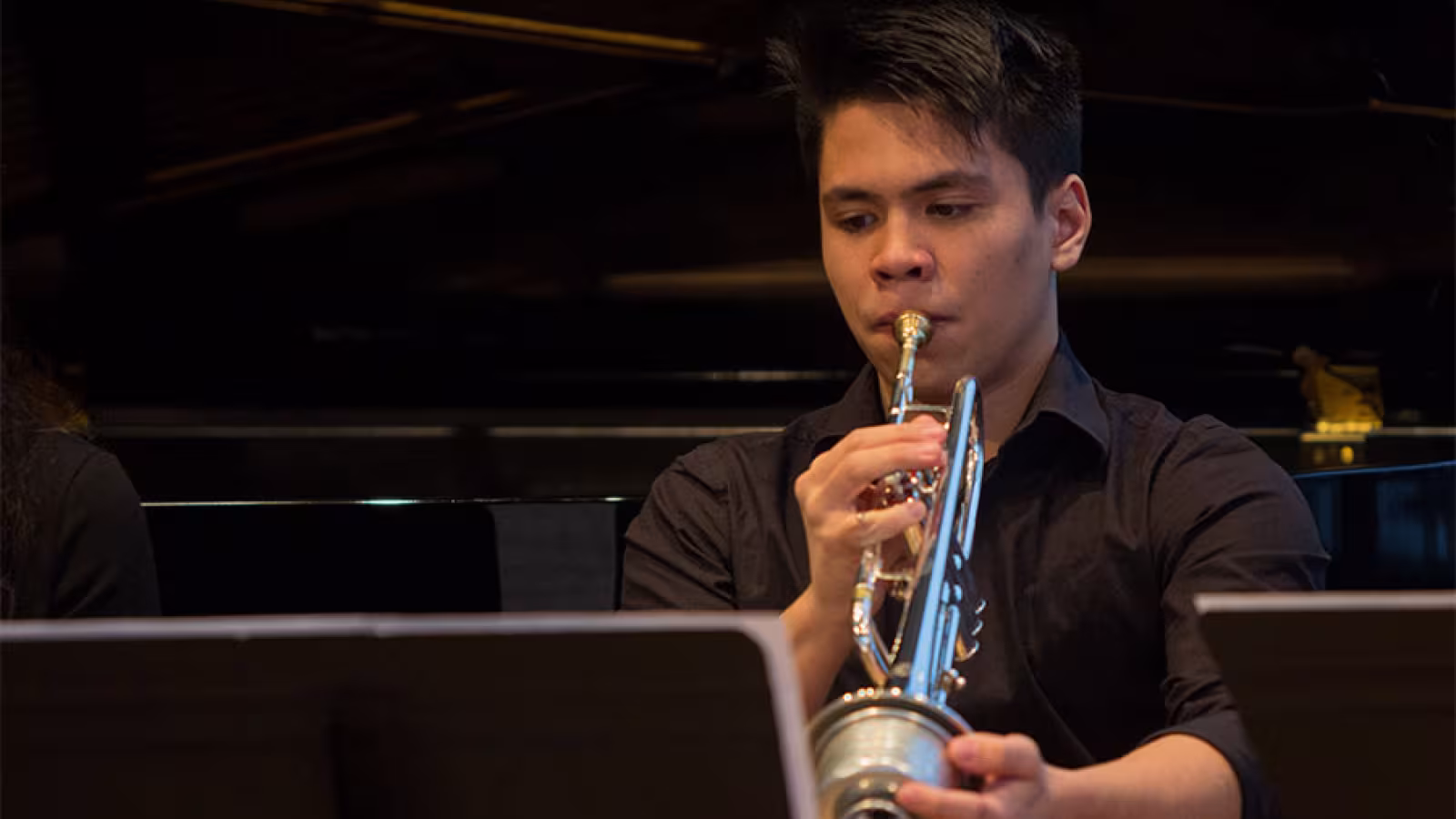 A boy playing trumpet