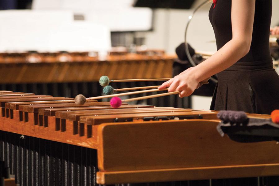 A girl playing xylophone