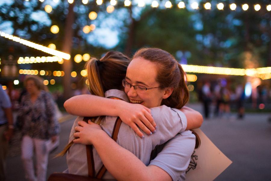 Students hug goodbye at the end of the summer