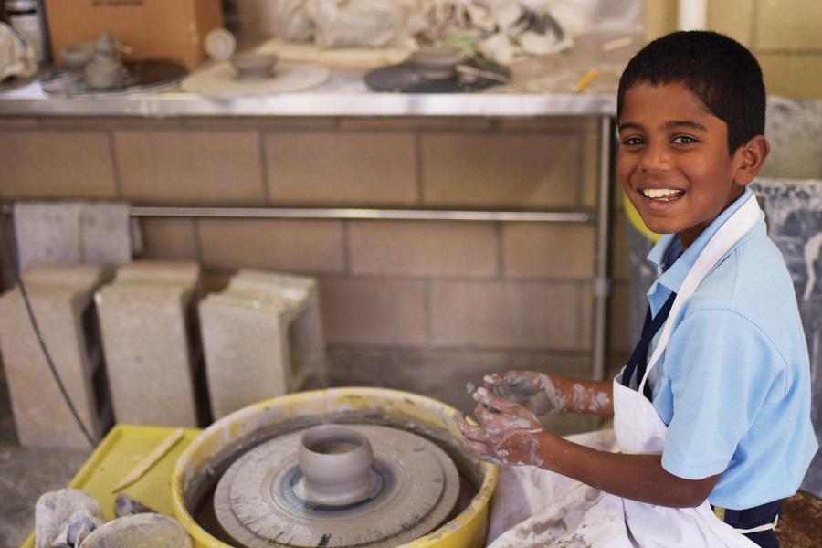 A boy at a potter's wheel