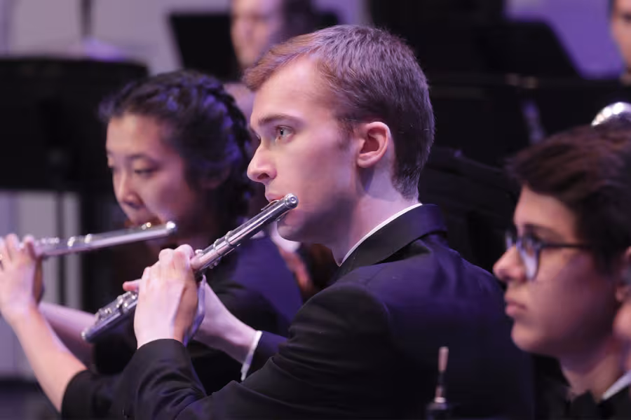 A boy playing the flute