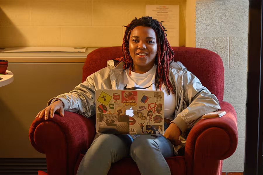A student works on a laptop