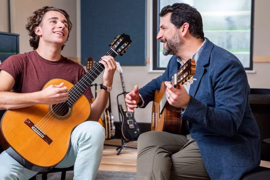A student enjoys a guitar lesson in the new Music Center.
