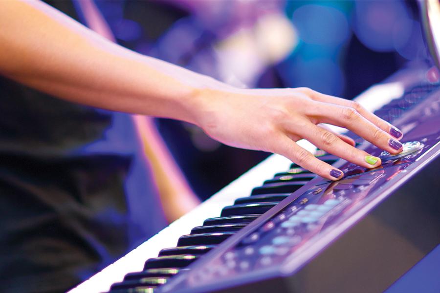 Stock image of a person playing a keyboard