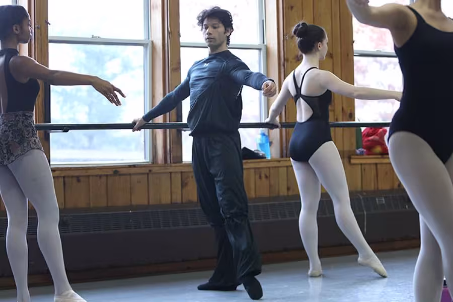 Cornejo works with a student at the barre.