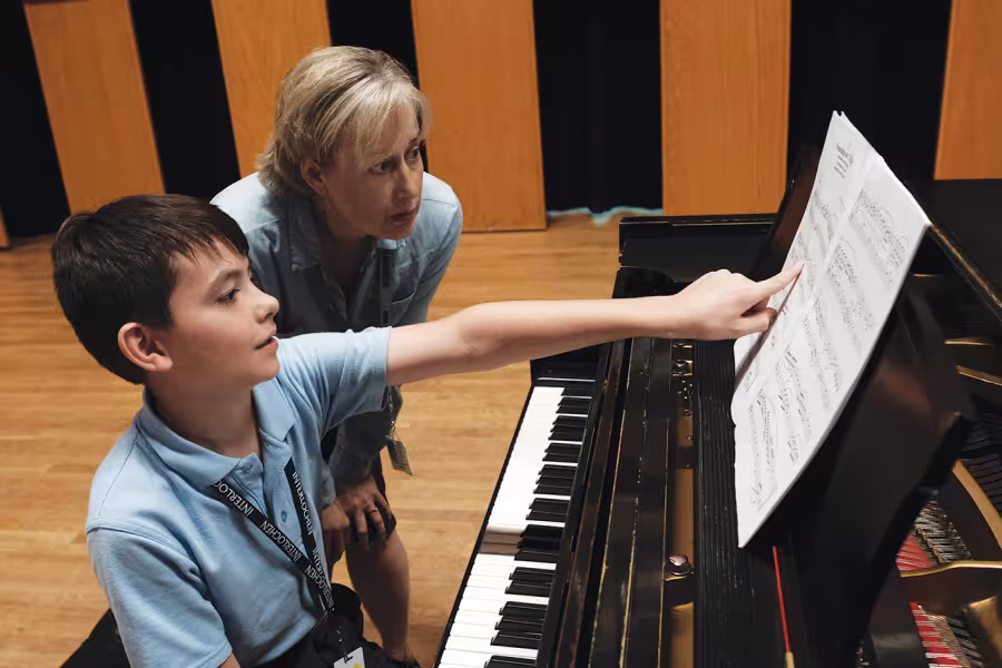 junior piano student works with faculty at interlochen arts camp