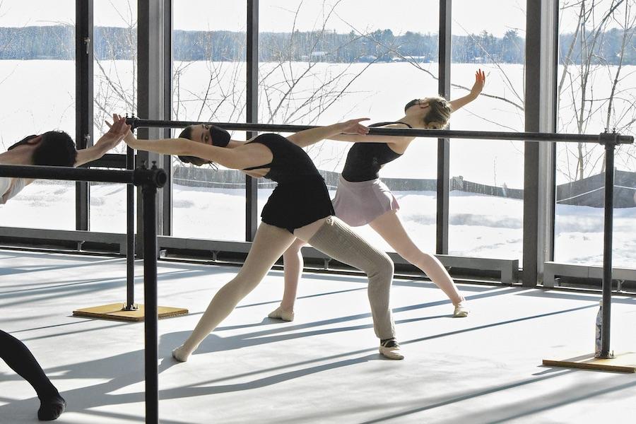 Interlochen Arts Academy students dance at the barre inside the Dance Center