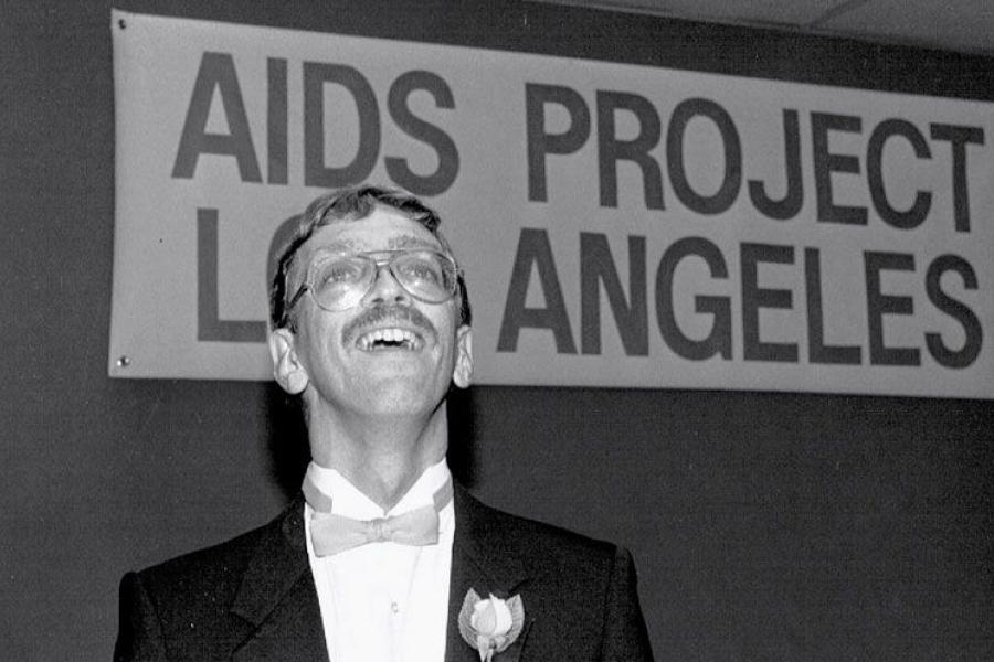 Pieters speaking at Elizabeth Taylor's September 1985 AIDS benefit.