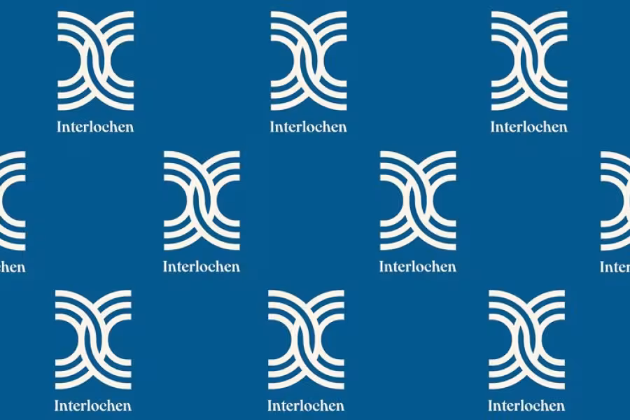 A backdrop of vertical Interlochen logos