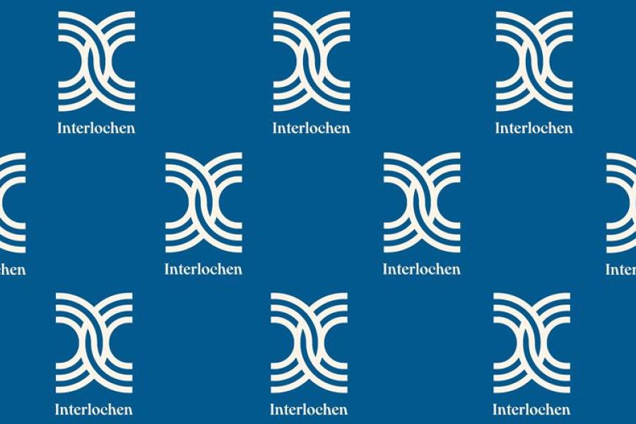 A backdrop of vertical Interlochen logos