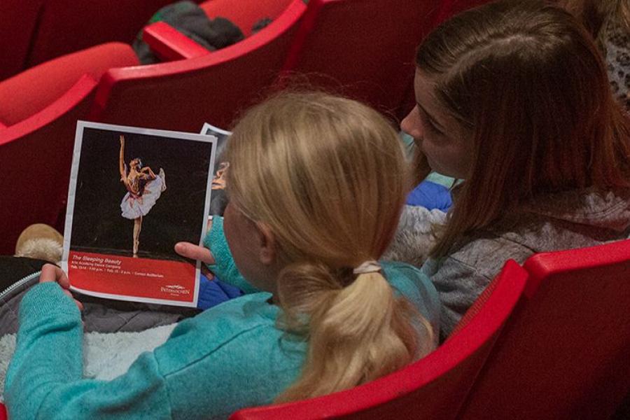 Middle school students look at a Sleeping Beauty program