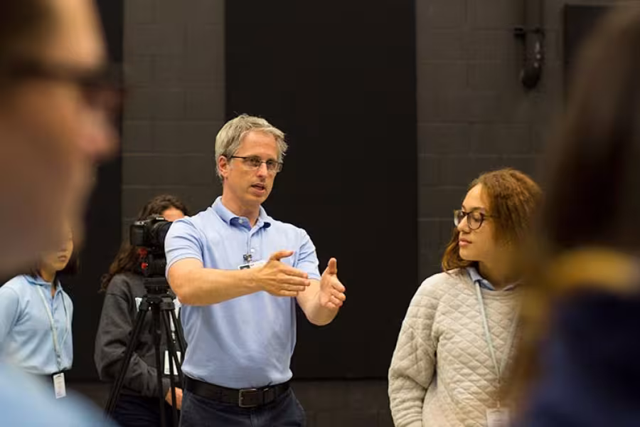 Michael Mittelstaedt works with a student at Arts Camp 2017