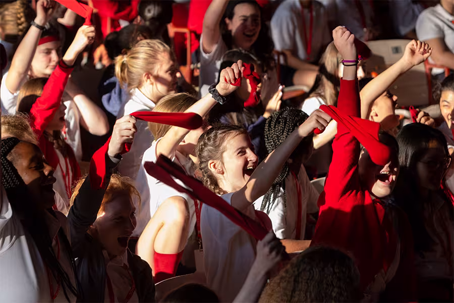 Intermediate students wave socks during First Gathering