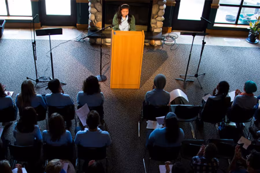 Creative writing student reads in front of an audience