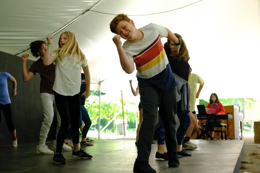 Intermediate musical theatre students practice choreography for “The Prom" in our Morley Tent.