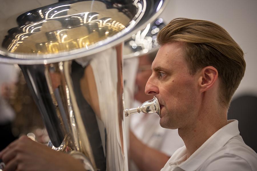 Photo of a man playing tuba