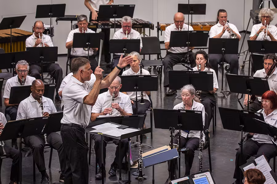 Photo of conductor leading Adult Band Camp concert