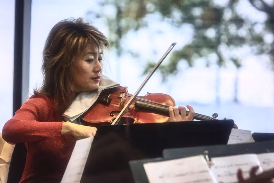 Tina Qu performs during the Dance Center dedication ceremony.