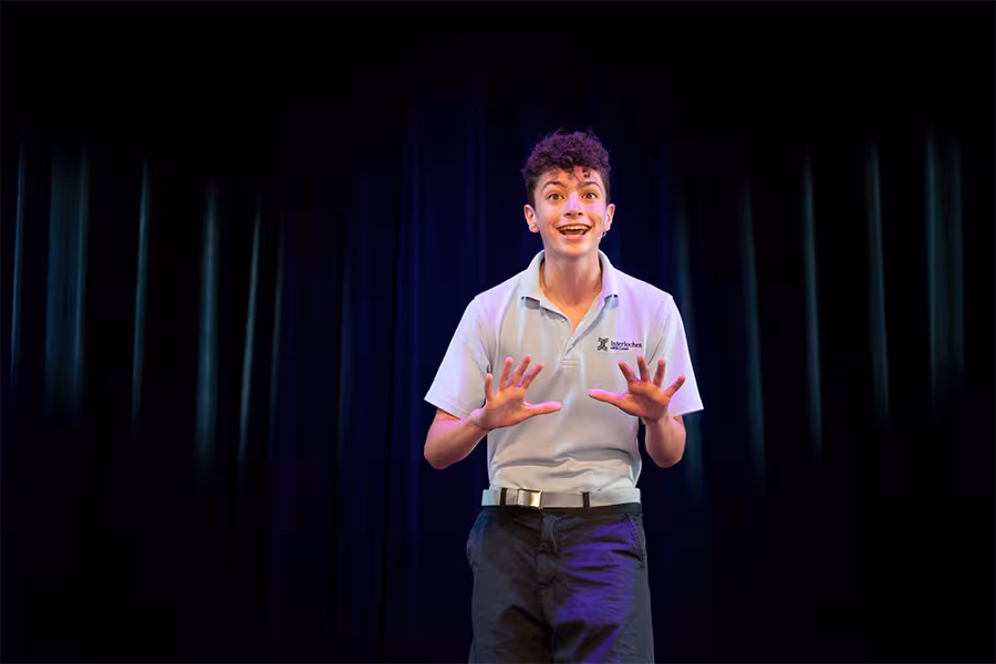 Theatre student performs on a stage.