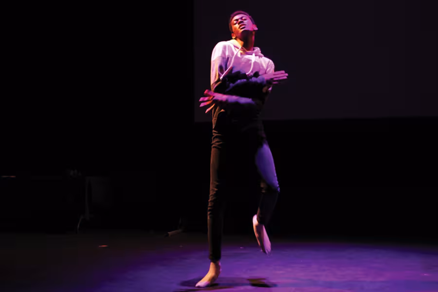 a male academy student in an interpretative dance performance