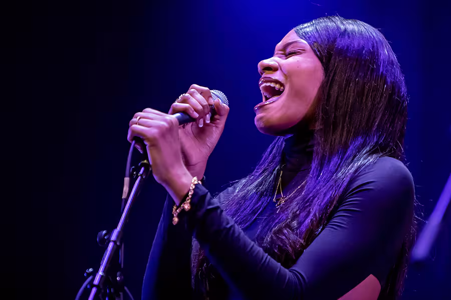 An Arts Academy singer-songwriter student performs during Festival 2022.