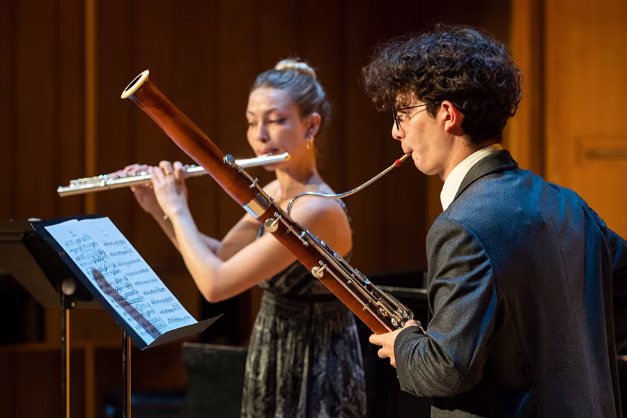A bassoonist and a flutist play a duet