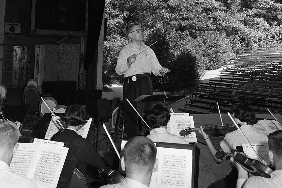 Ottokar Cadek conducts a violin sectional in Kresge Auditorium, 1955