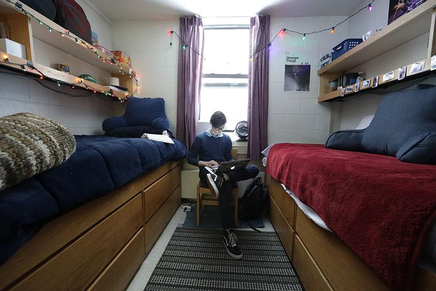 A student in a dorm room
