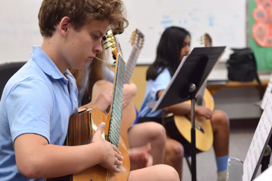 Classical guitar student practices during Interlochen Arts Camp