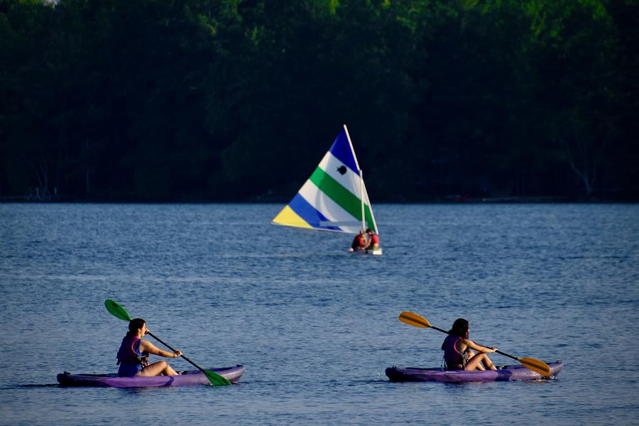 Interlochen Arts Camp students kayak and sail on Green Lake