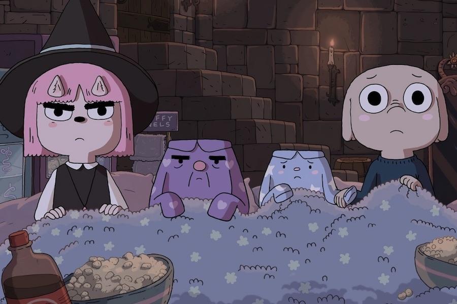 Four cartoon characters sitting under a blanket exhibit scared or disgruntled expressions.