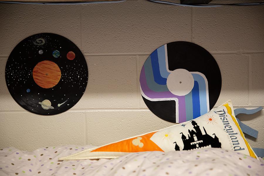 Two painted records adorn the walls of an Arts Academy student's residence hall room.