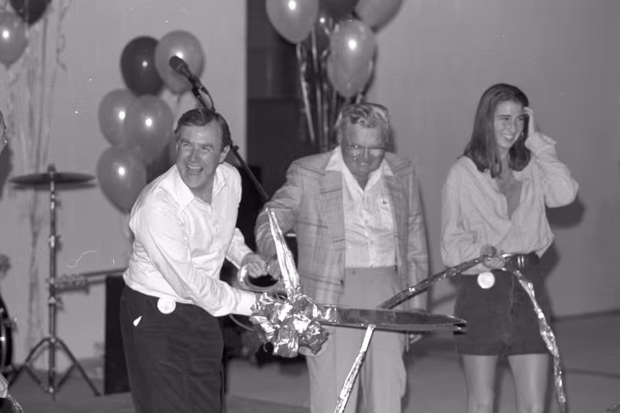 Dean Boal cuts the ribbon during the Phoenix Theatre dedication. 