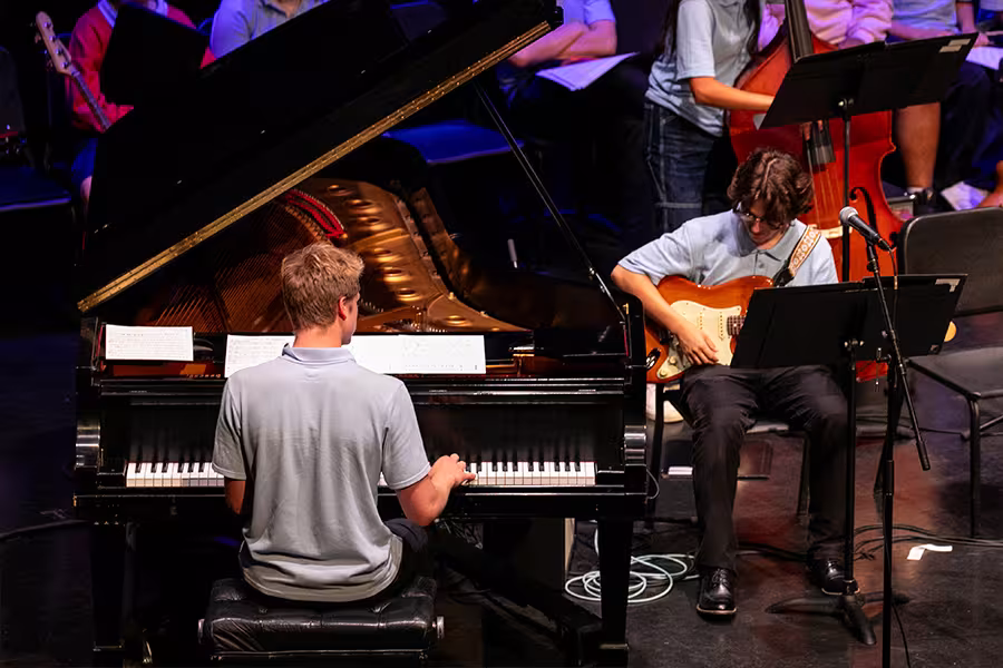 jazz pianist and an electric bass player perform in concert
