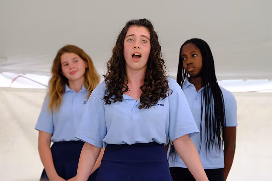 three camp students performing opera