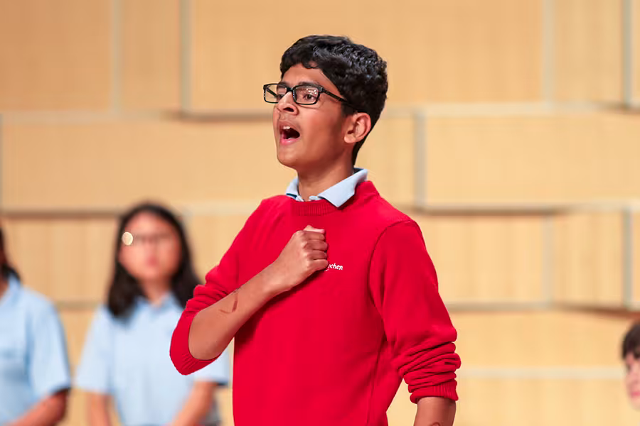 a camp student singing with passion