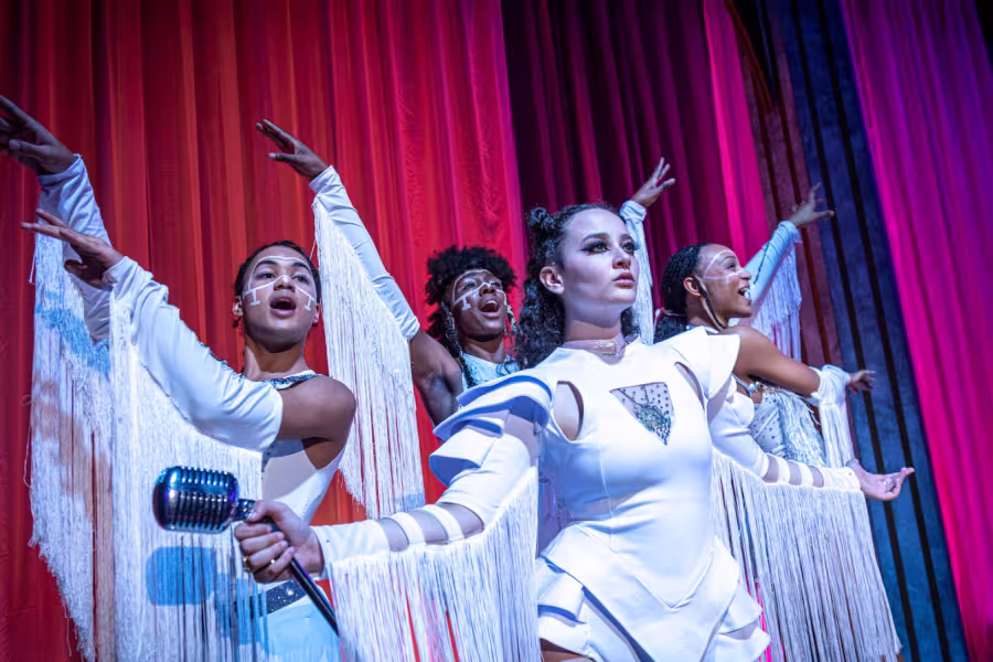 4 Interlochen students posing in dramatic white costumes for Jesus Christ Superstar musical theatre