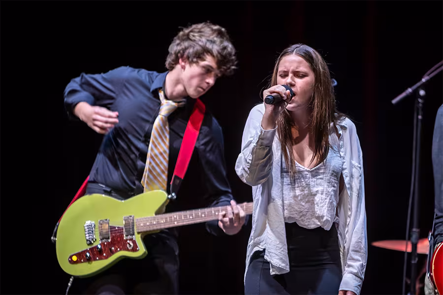 two students rocking out