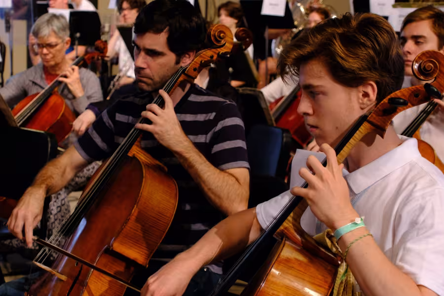 An orchestra paying in rehearsal.