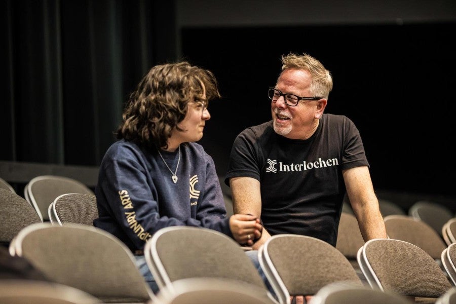 Director of Interdisciplinary Arts Clyde Sheets speaks with an Arts Academy student