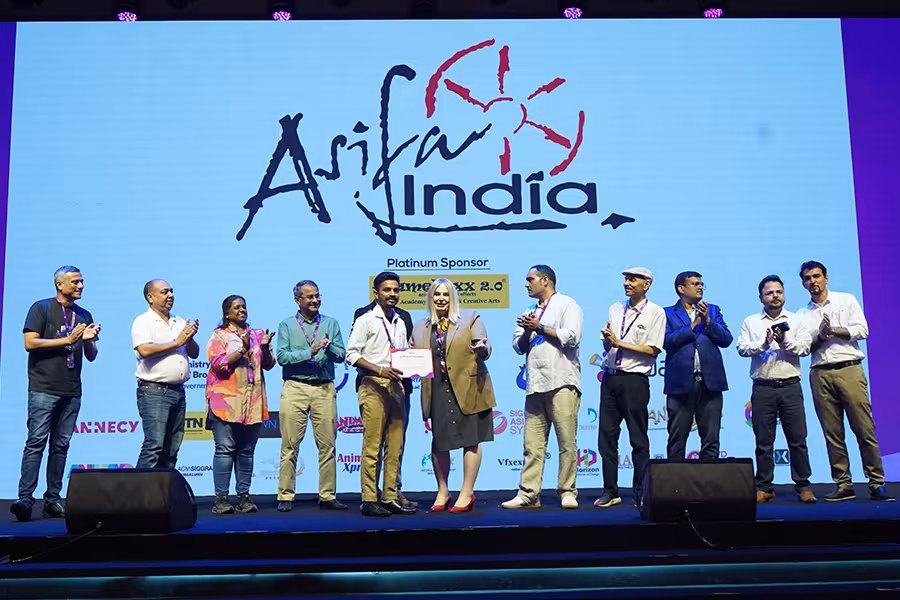Briana Yarhouse (center, tan blazer) presents an award at WAVES. 