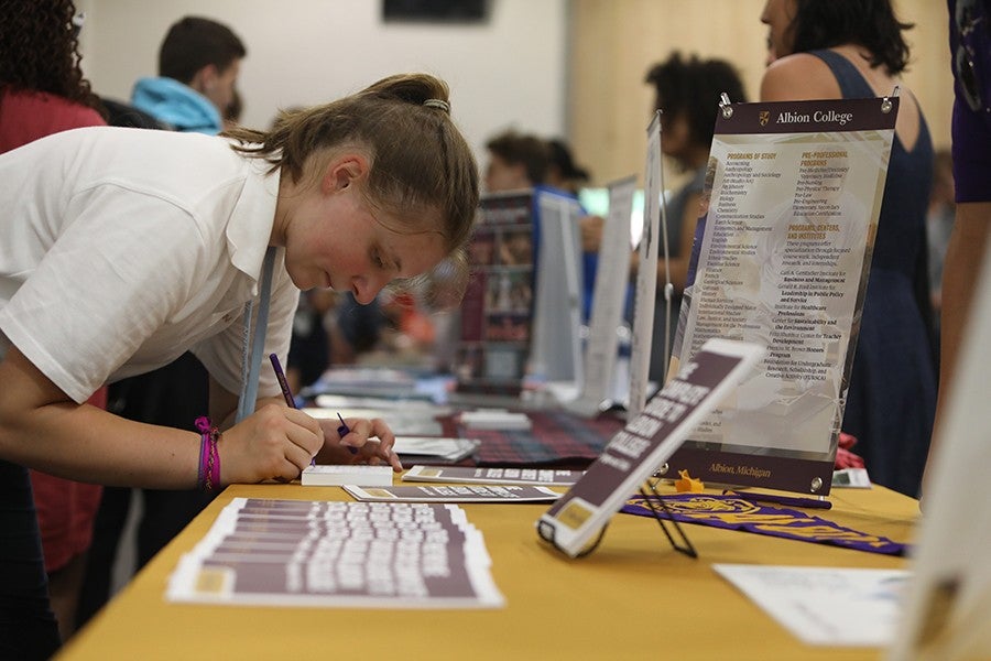 An Interlochen Arts Camp student fills out an interest card at the annual college fair. 
