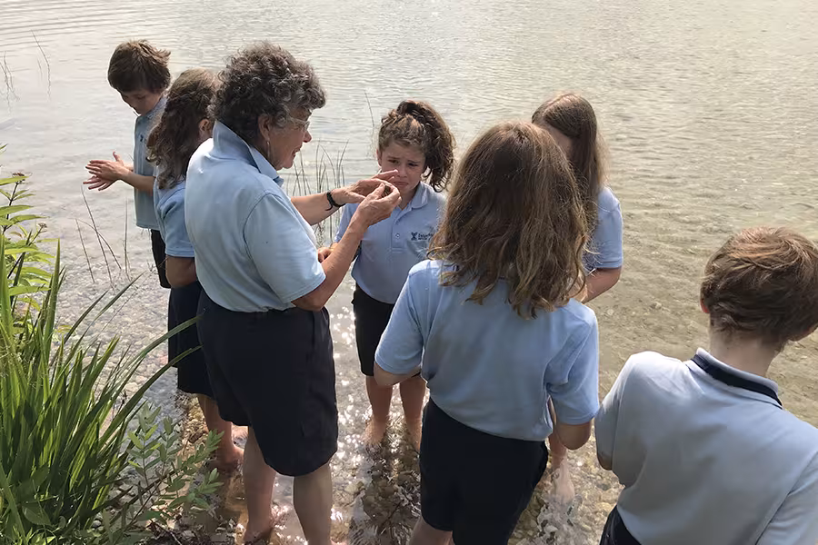 Junior students look for Petoskey stones during Environmental Exploration class. 