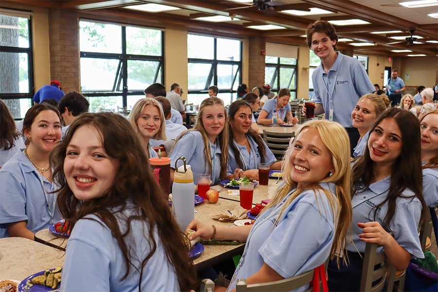 High school students pose for a picture in Interlochen’s Stone Cafeteria.